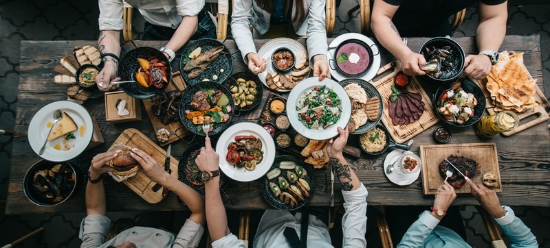 Wooden table with various foods