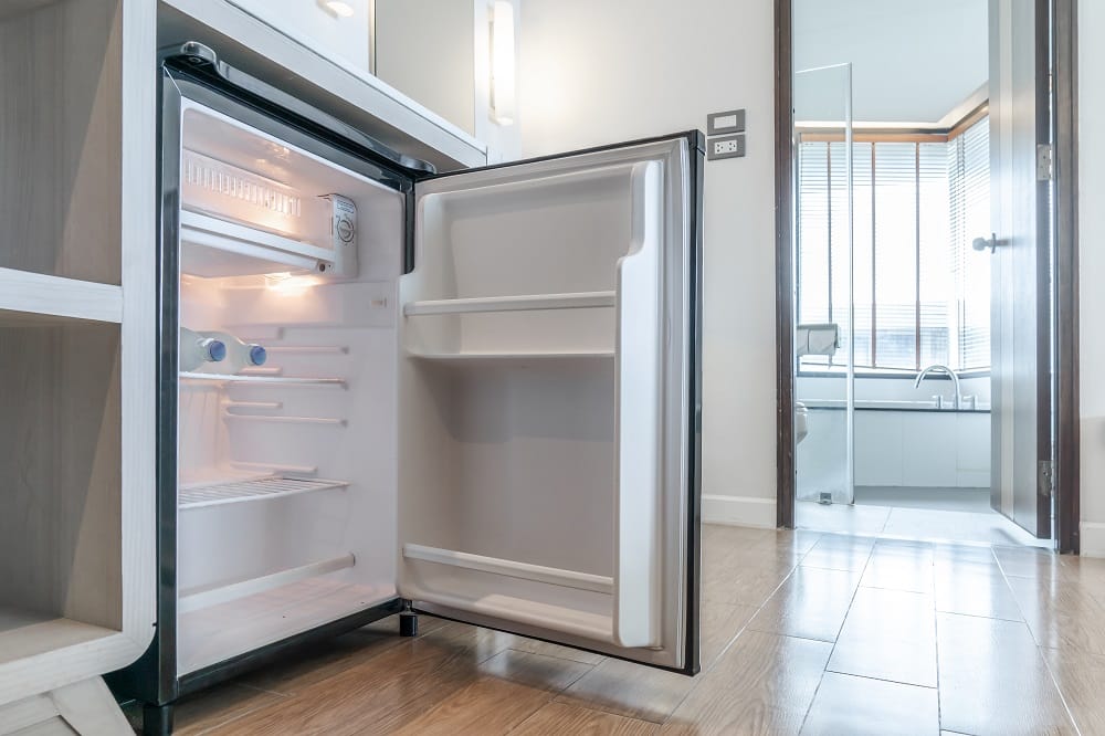 opened small refrigerator under the counter