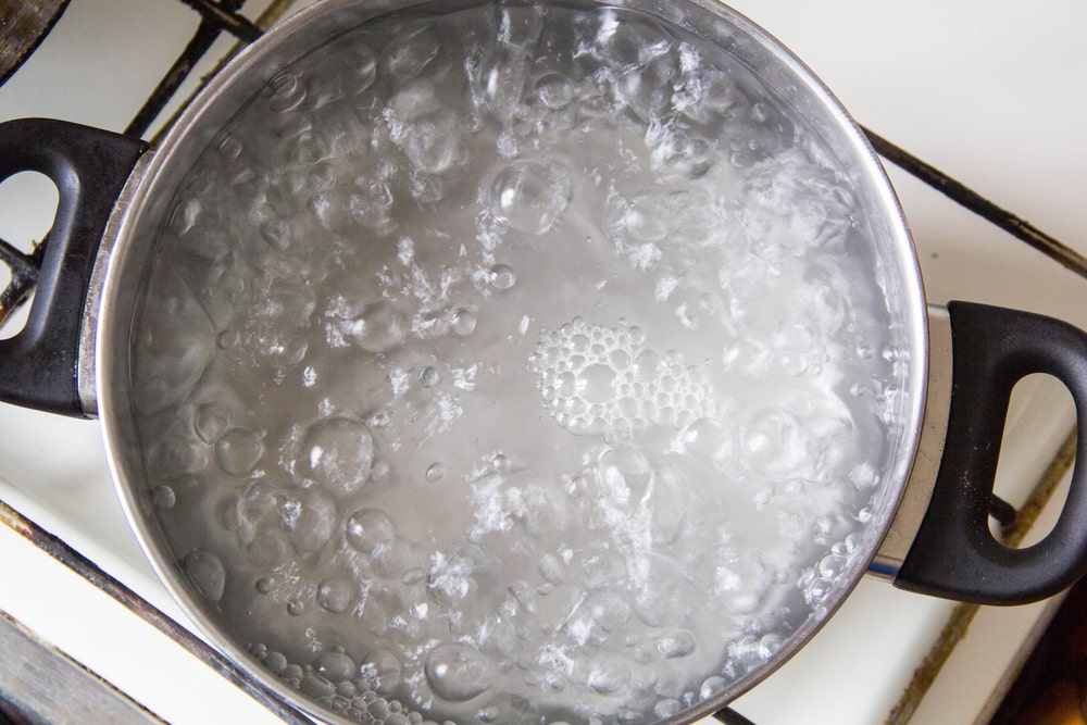 How To Speed Up Boiling Water On The Stove With Just A Pan