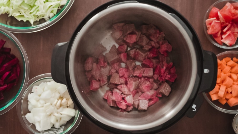 Cooking beet soup, borscht with pressure cooker