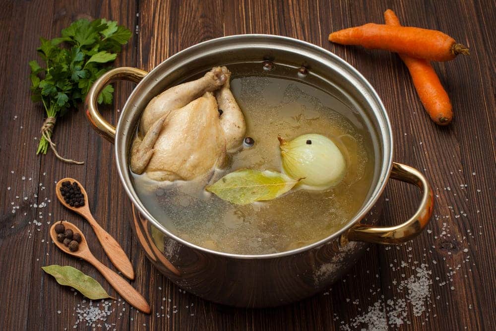 Chicken broth vegetables spices saucepan