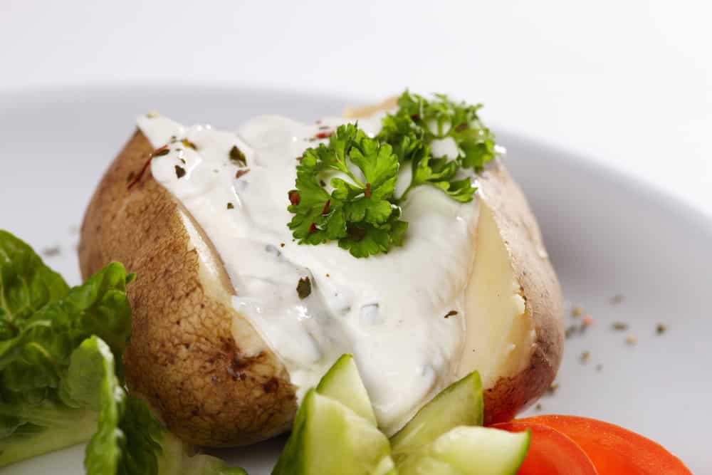 Baked potato with cream fraiche and a side salad