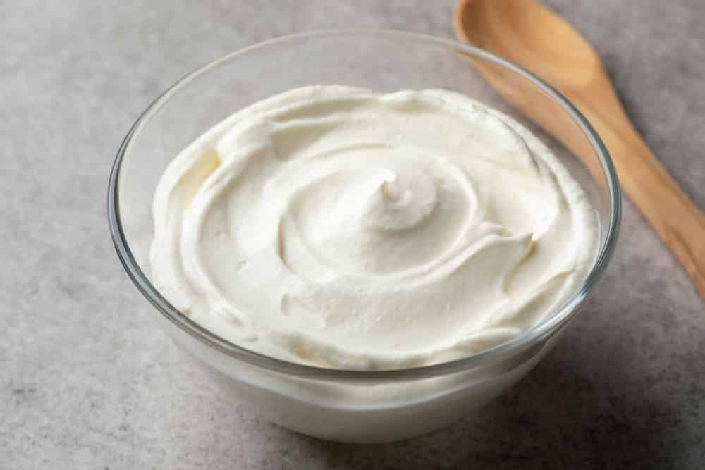 Fresh plain creme fraiche in a bowl as an ingredient