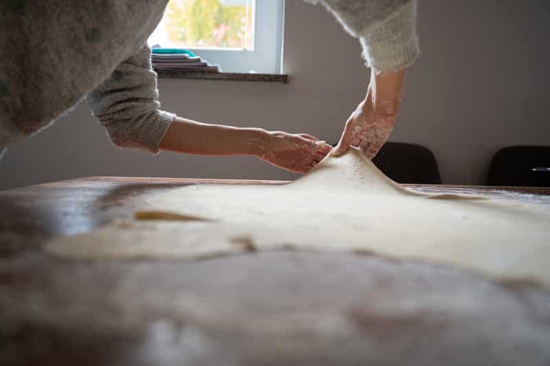 Pulling homemade phyllo strudel dough