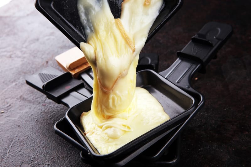 raclette cheese melted served individual skillets
