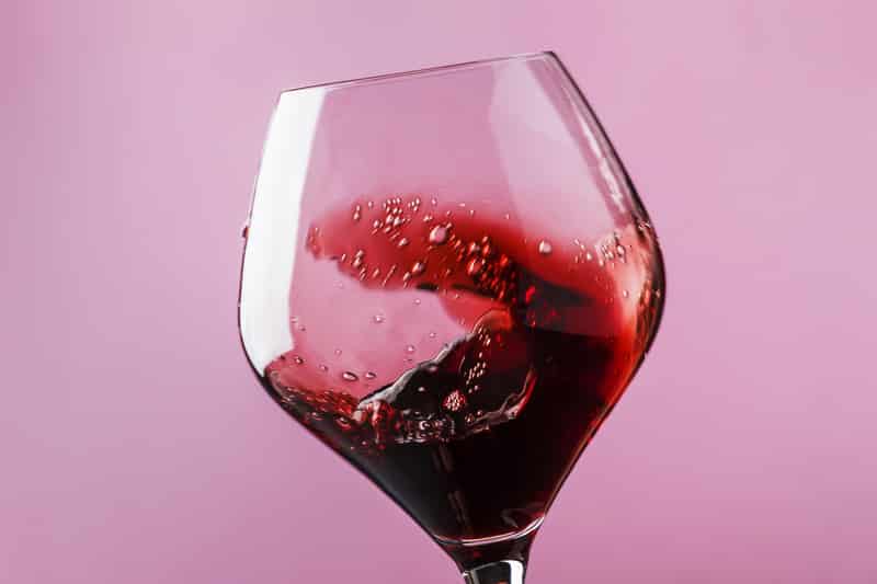 dry red wine splash glass pink
