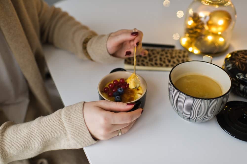 girl eating Creme brulee