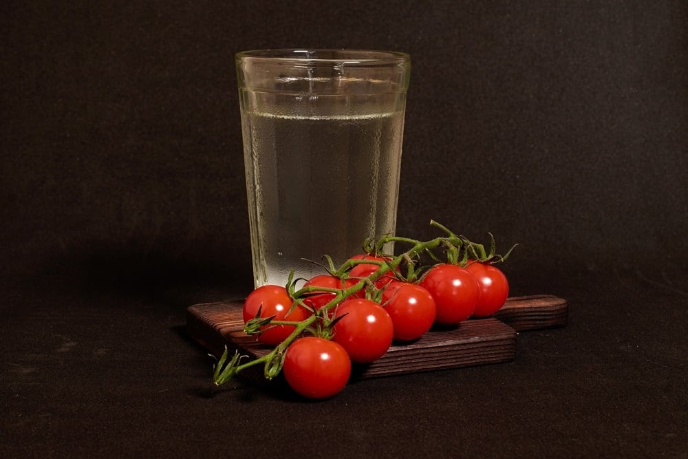 vodka and a branch of cherry tomatoes