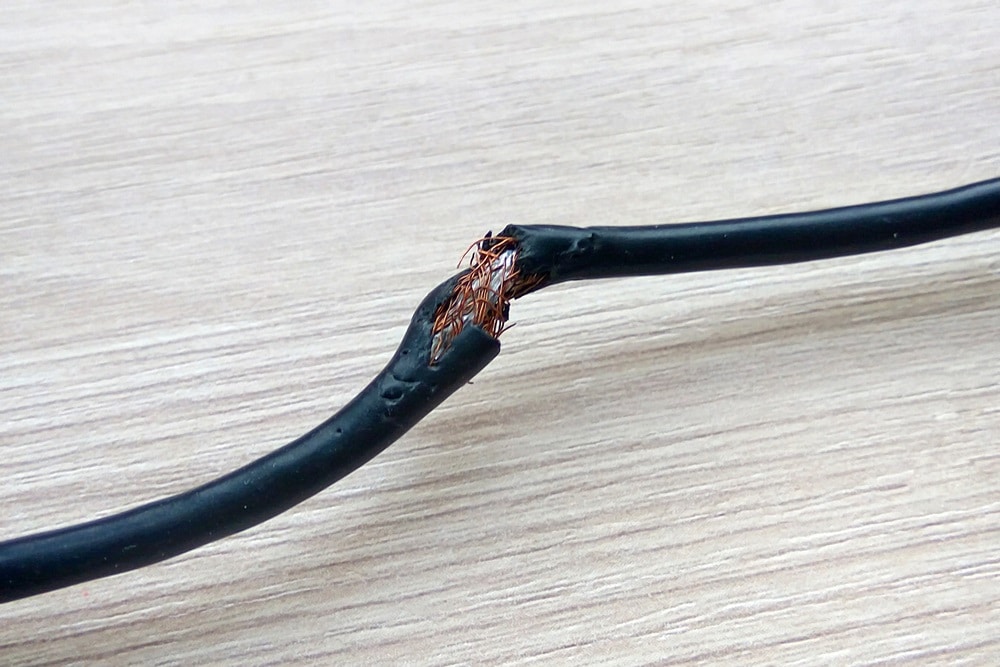 Damaged black electric cord