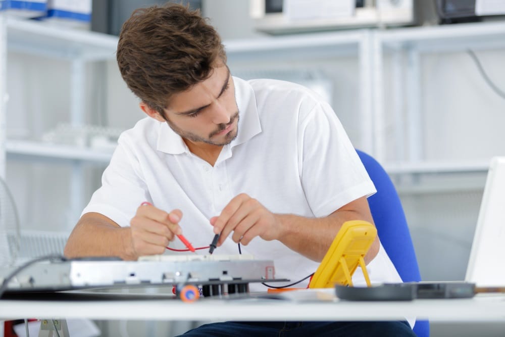 electrician testing induction hobs