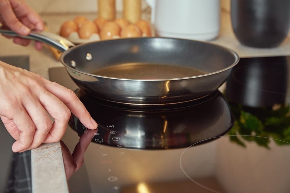 induction stove with steel frying pan