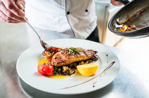 Chef is plating food