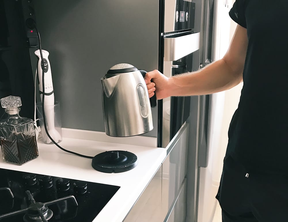 Man holding kettle