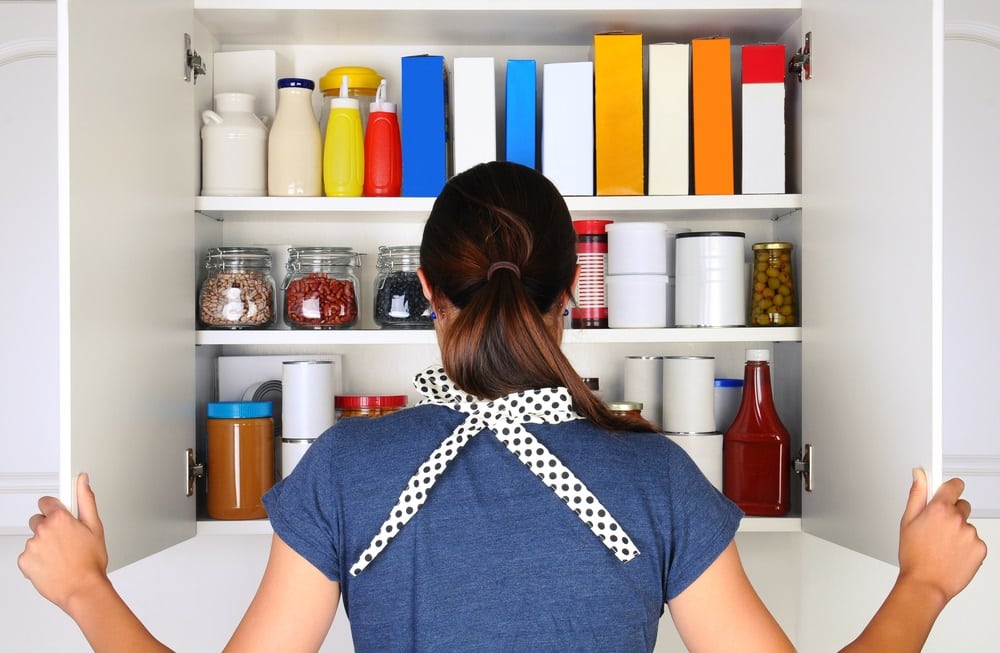 woman opening up pantry door