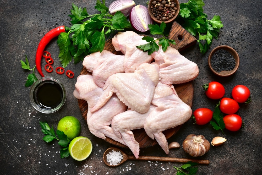 Raw chicken wings with ingredients
