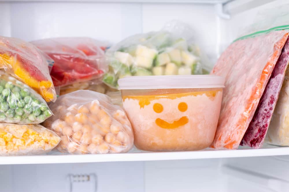 Freezer with vegetables and fruits inside