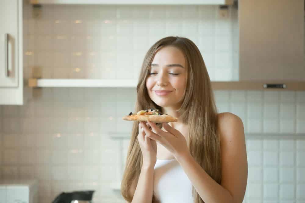 woman enjoy smelling food