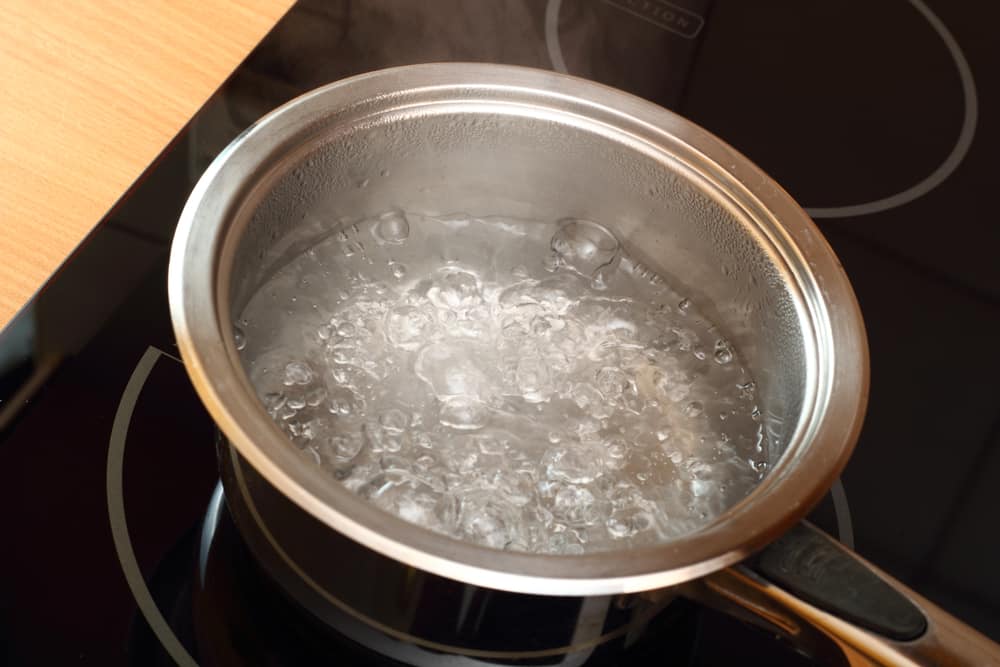 does water boil faster with or without a lid