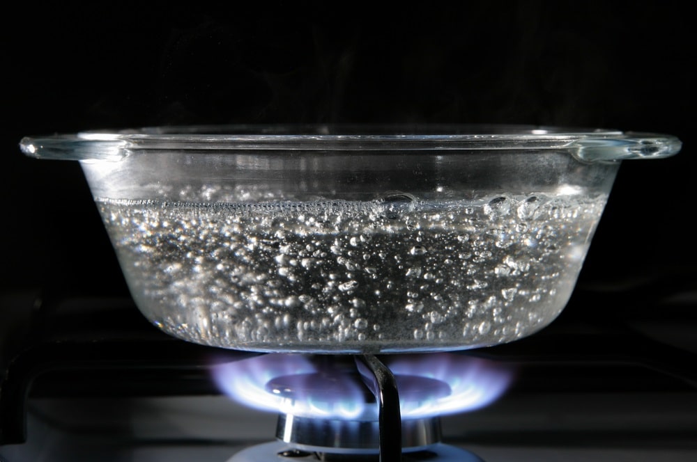 Glass saucepan on the gas stove
