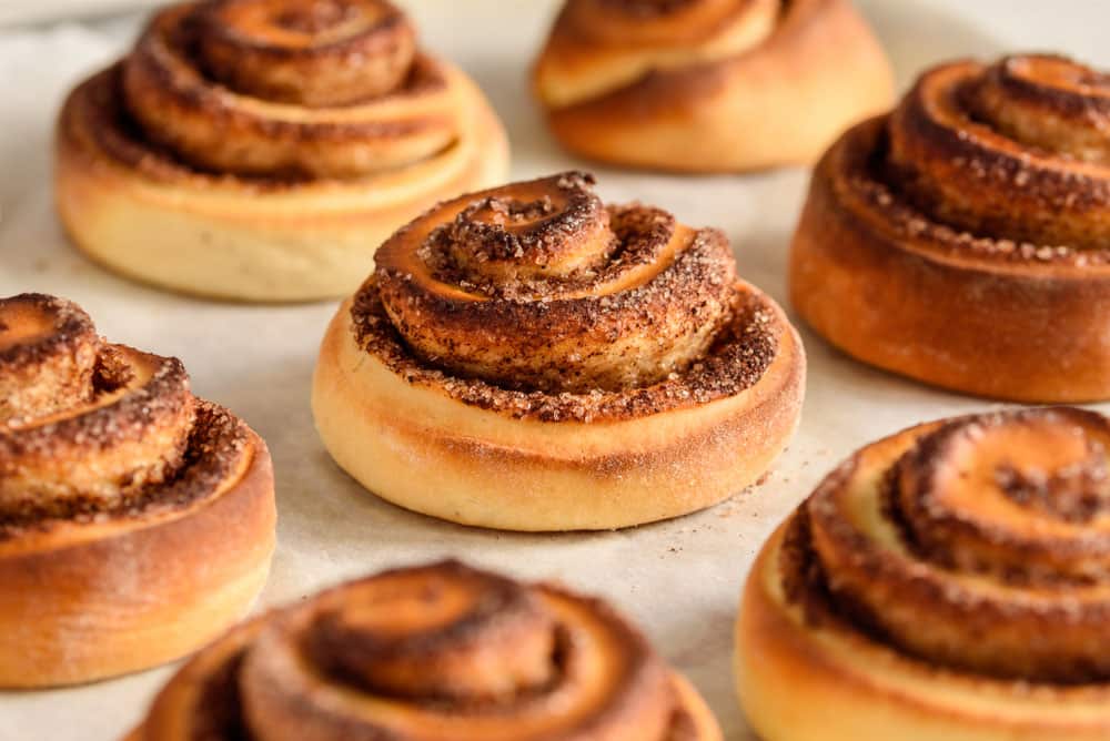 Cinnamon rolls close up. Cinnamon buns on a baking sheet