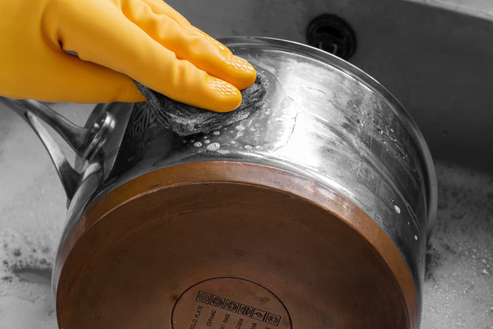 Cleaning a stainless steel and copper saucepan