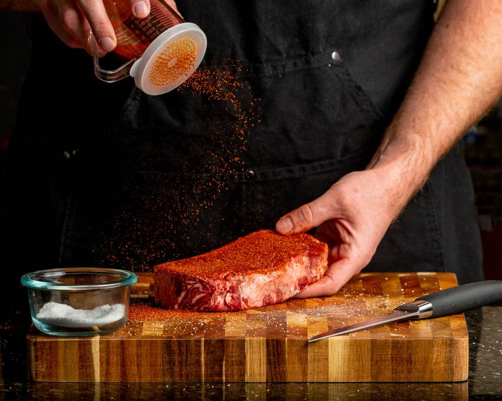 dry rub seasoning on new york strip steak