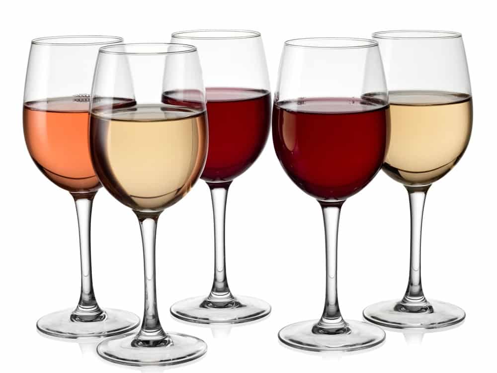 Five glasses with red, white and rose wine