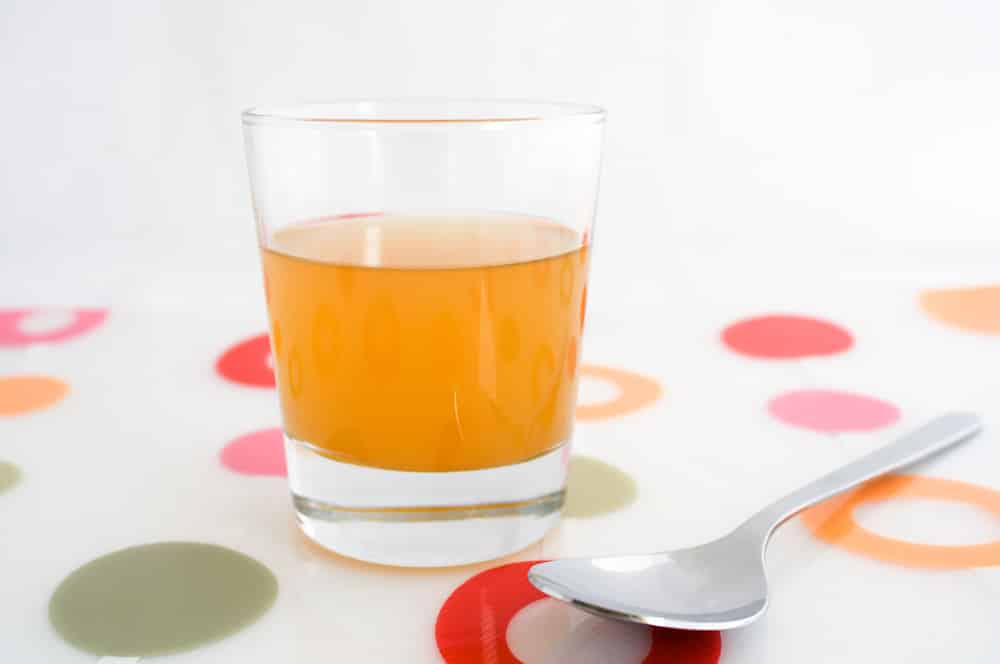 A glass of raw, unfiltered apple cider vinegar