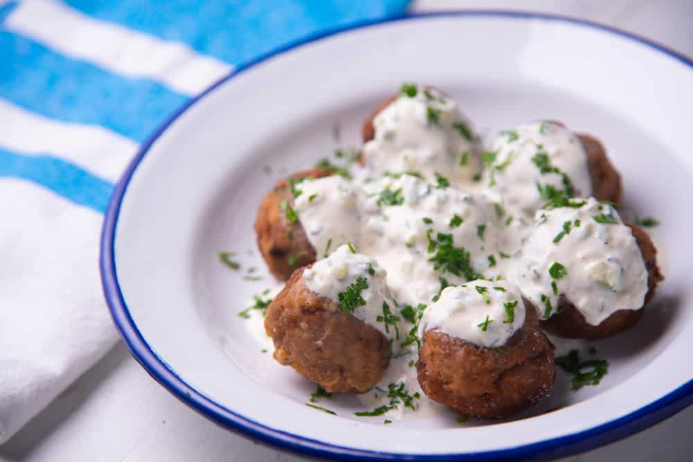 Greek meatballs with tzatziki cooked in a restaurant