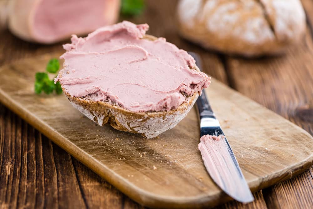 Homemade Liverwurst Sandwich on an wooden table 