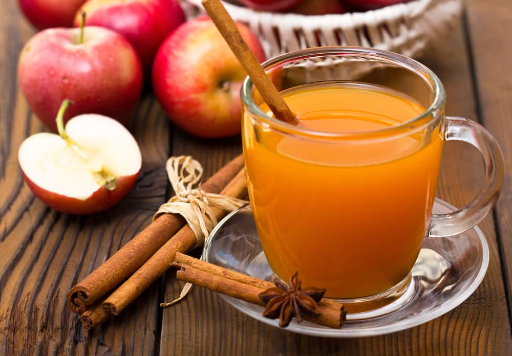 Hot apple cider with cinnamon sticks