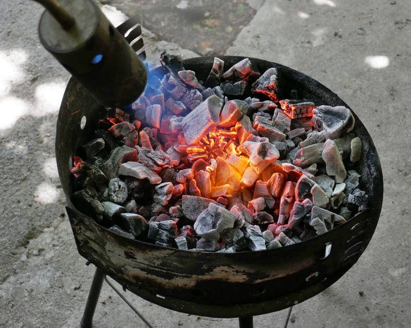 kindling coals roasting meat grill using gas