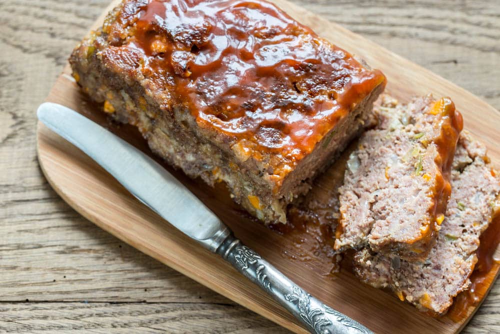 Meat loaf with barbecue sauce on the wooden board