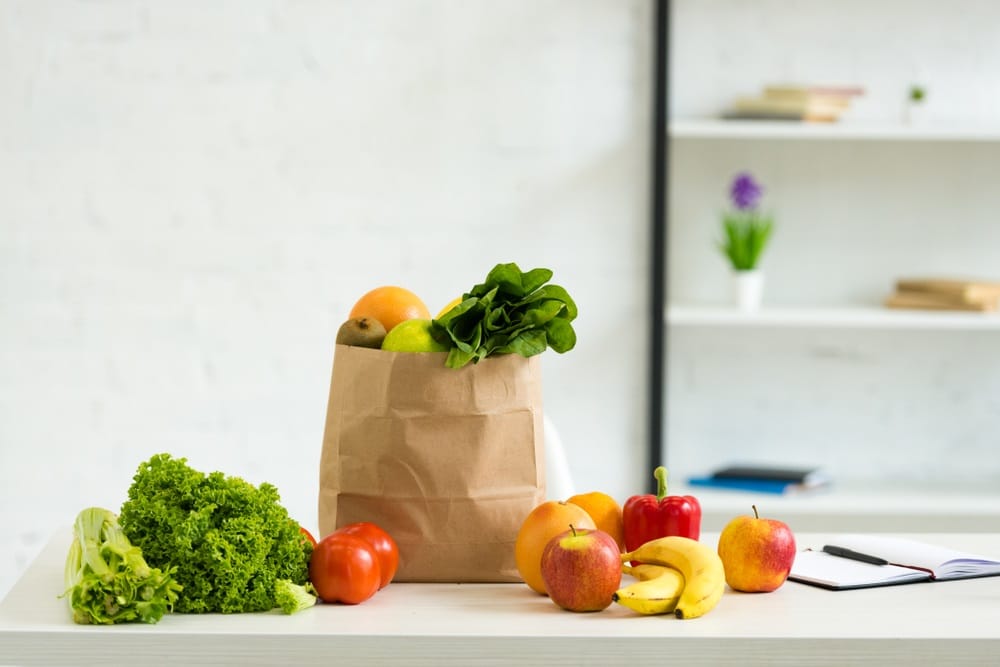 paper bag with fresh fruits and vegetables