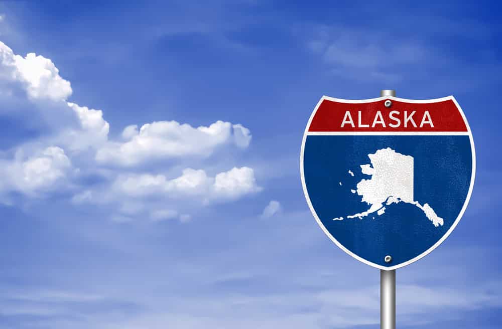 Road sign with the map of Alaska