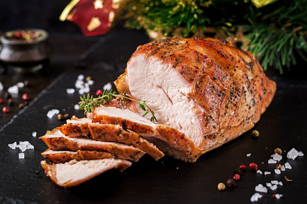 Roasted sliced Christmas ham of turkey