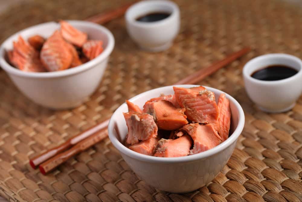 Roasted Sockeye salmon pieces served with soy sauce