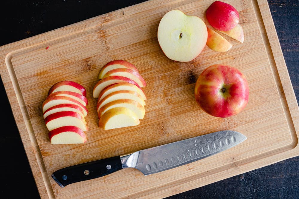Sliced Honeycrisp Apples on a Bamboo Cutting Board