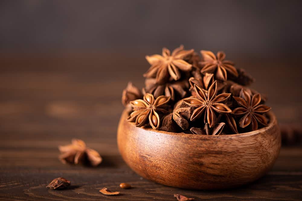 star anise in a wooden bow