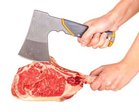 a tomahawk steak is cut to resemble a hand-axe
