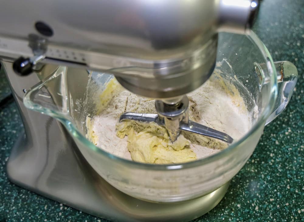 View of sugar cookie ingredients being mixed in a glass bowl