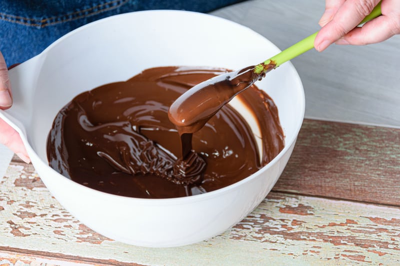 confectioner tempering chocolate spatula white bowl
