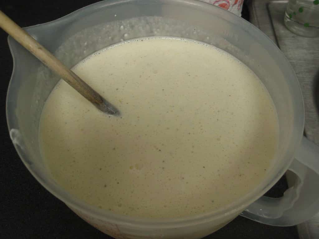 evaporated filled milk in measuring cup