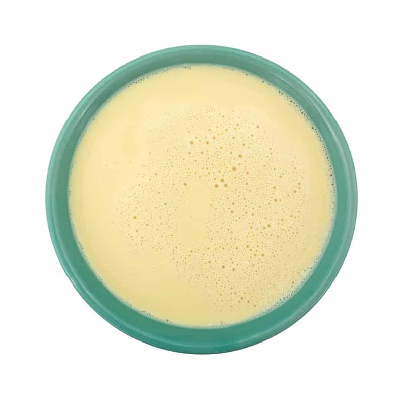 evaporated milk bowl white background top view