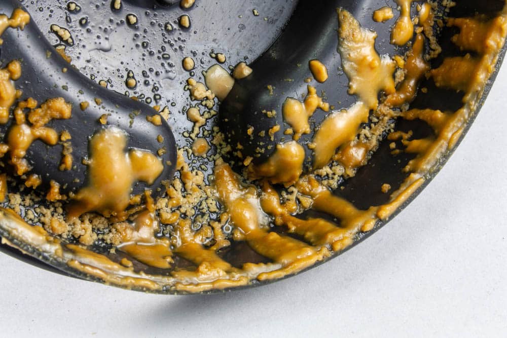 Peanut butter splashes on the lid of the food blender