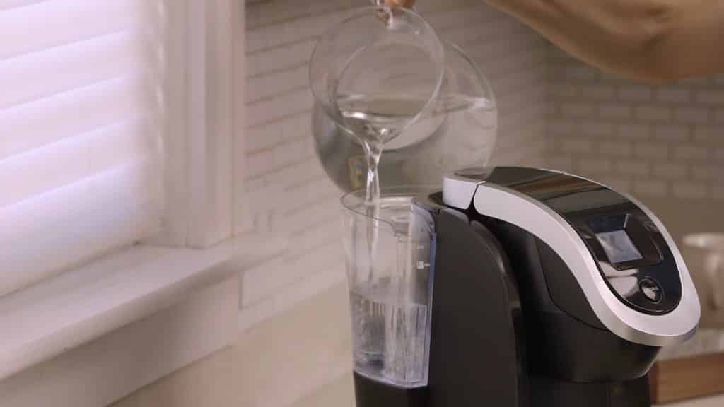 pouring water in Keurig coffeemaker