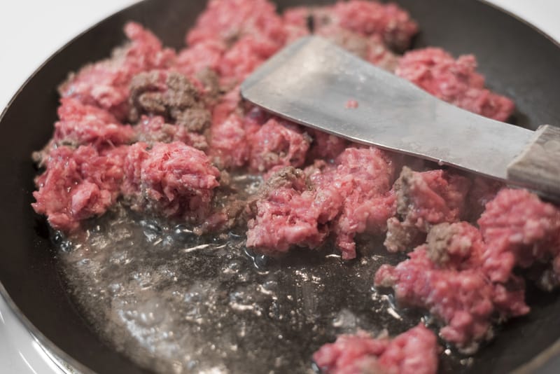 raw ground beef lots grease kitchen pan