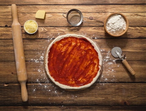 Tomato atop pizza crust