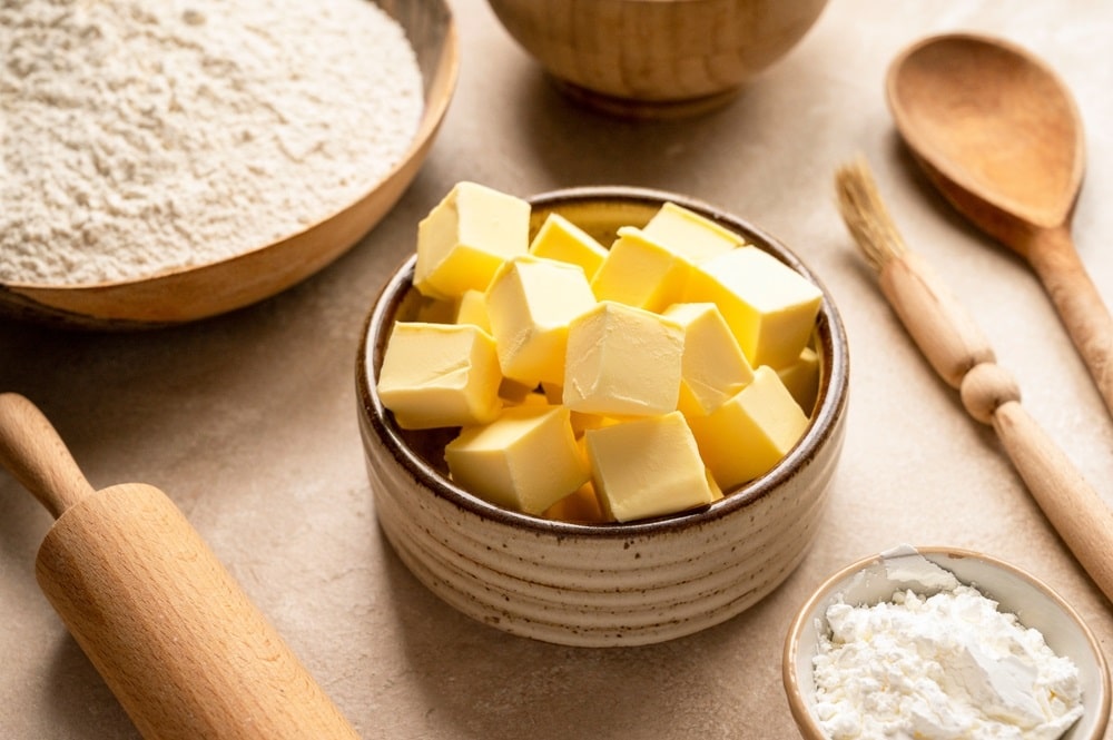 Butter cubes and baking ingredients flour