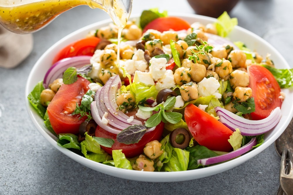 Greek salad  drizzled with dressing